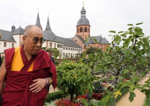 Tibetan spiritual leader the Dalai Lama walks through the garden during visit to monastery in Seligenstadt