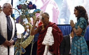 Exiled Tibetan spiritual leader the Dalai Lama blesses a scarf for Illinois Governor Quinn and actress Beals in Chicago