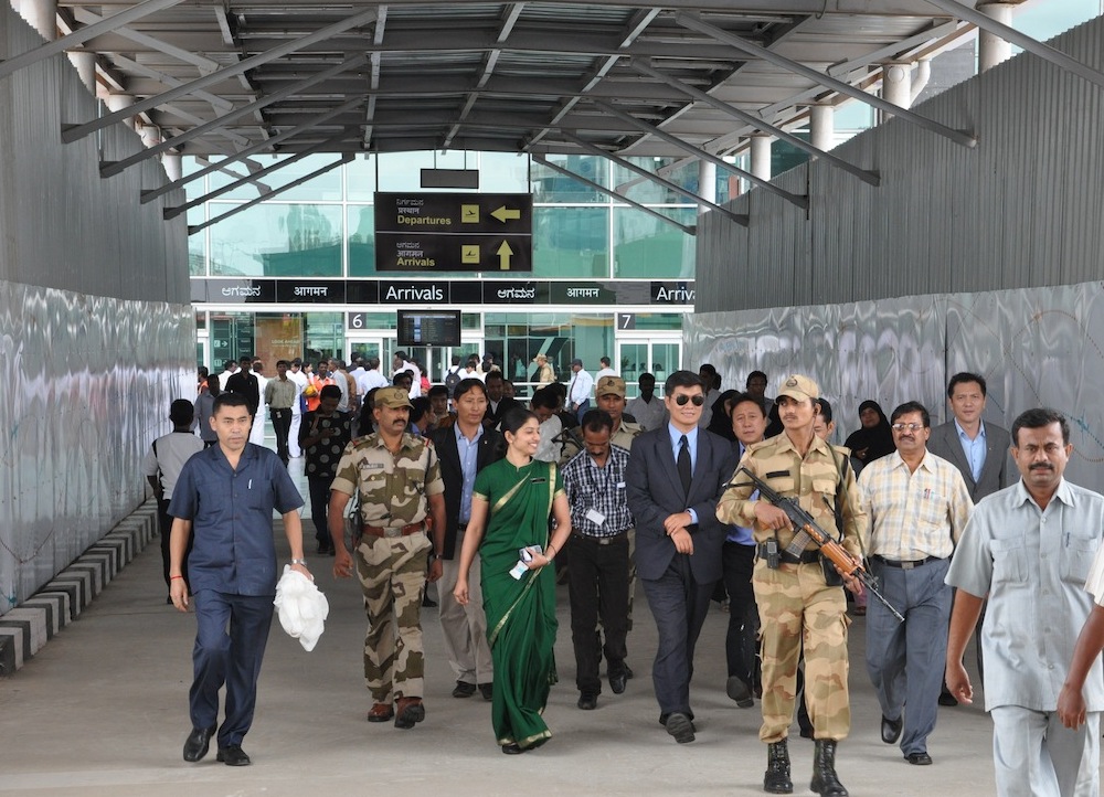 Kalon Tripa Dr Lobsang Sangay escorted by officials on his arrival at airport in Bangalore on 29 July 2012/Photo/JIgme Tsering/TibetNet