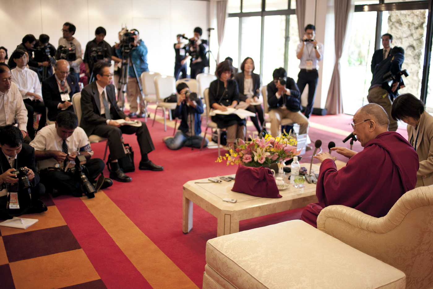 His Holiness the Dalai Lama answering reporters' questions during a press conference in Okinawa, Japan, on 12 November 2012