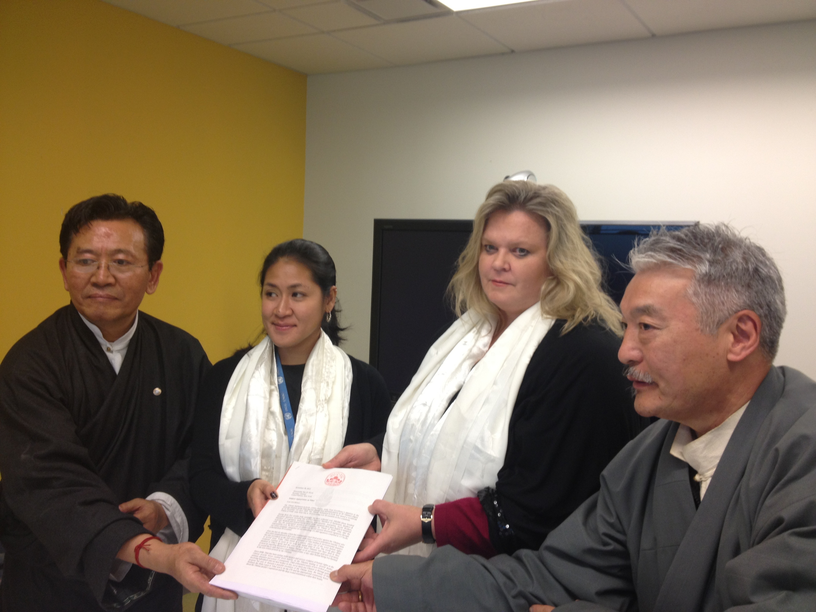 Tibetan Parliamentarians, Mr Norbu Tsering (1st L) and Mr Tashi Namgyal (1st R) submitting petition on Tibet to Ms Maarit Kohonen Sheriff, the UN's Deputy Head of the Office of High Commissioner for Human Rights and Ms Ann Syuata, Human Rights Officer, at the UN headquarters in New York on 10 December 2012