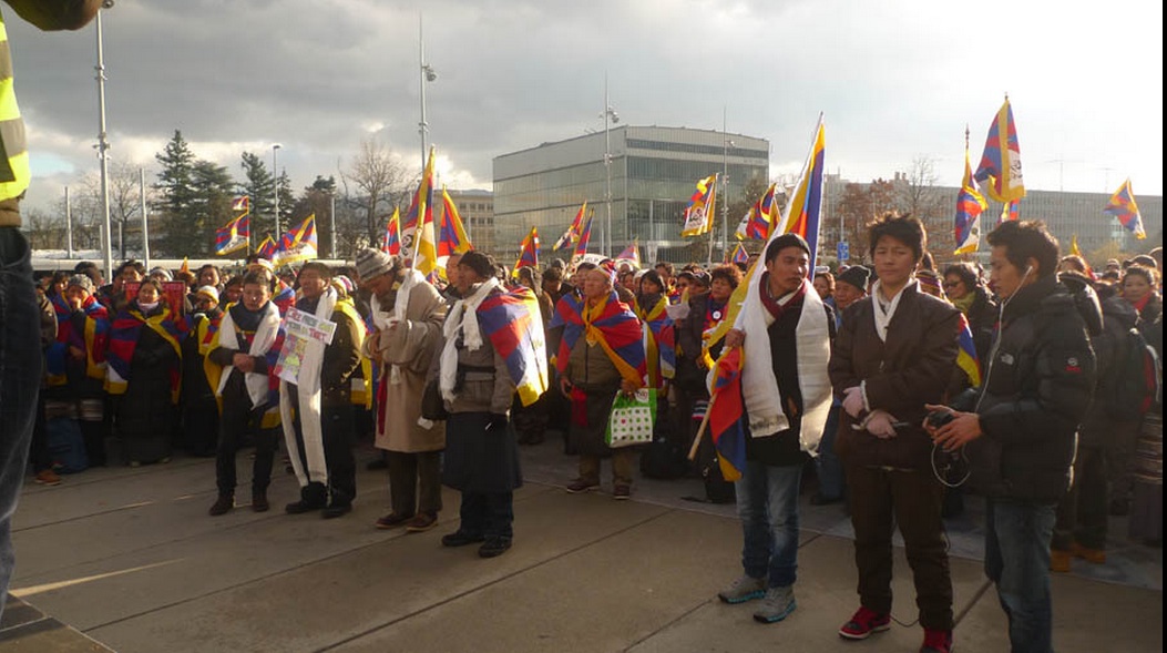 Tibetans gather for a rally in front of the UN office in Geneva on 10 December 2012
