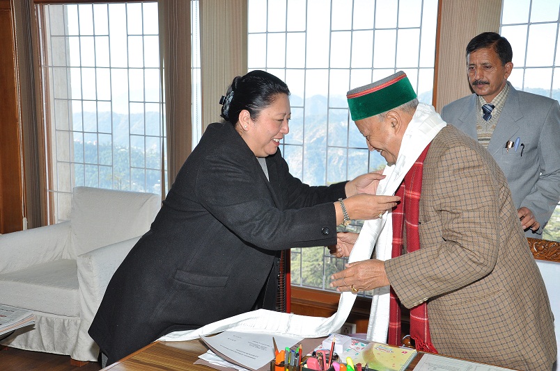 Home Kalon Dolma Gyari offers a greeting scarf to Chief Minister Virbhadra Singh during a meeting in Shimla, India, on 1 March 2013