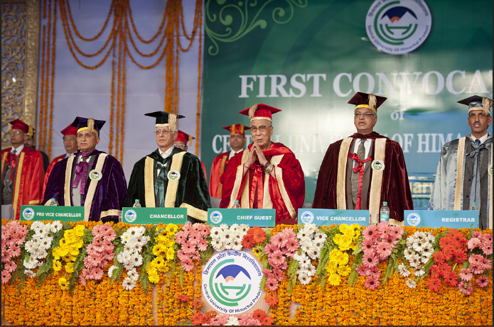 His Holiness the Dalai Lama along with university officials during the singing of the Indian national anthem at the first convocation of the Central University of Himachal Pradesh in Shahpur, HP, India on 28 February 2013/Photo/Tenzin Choejor/OHHDL