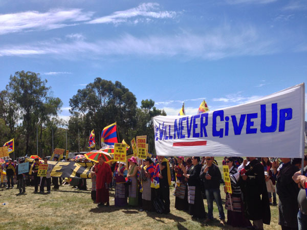 Tibetans and supporters take part in a rally to seek Australian government and parliament's support to resolve the issue of Tibet, in Canberra, Australia, on 18 March 2013