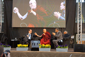 His Holiness the Dalai Lama during his talk "Happiness in a Troubled World" in Palatrento Stadium in Trento, Italy, on April 11, 2013. Photo/Jeremy Russell/OHHDL