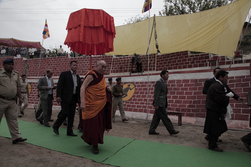 A school official and student welcome His Holiness the Dalai Lama as he arrives to give a short teaching as part of the golden jubilee celebrations of the CST school at Dalhousie, India, on 27 April 2013/Photo/Sangjey Kyab