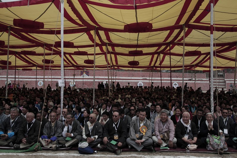 Former student of Central School for Tibetans, Dalhousie, listening to His Holiness the Dalai Lama's teaching as part of the golden jubilee celebrations of the school at Dalhousie, India, on 27 April 2013/Photo/Sangjey Kyab