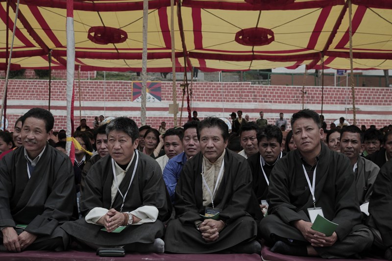 Former student of Central School for Tibetans, Dalhousie, listening to His Holiness the Dalai Lama's teaching as part of the golden jubilee celebrations of the school at Dalhousie, India, on 27 April 2013/Photo/Sangjey Kyab