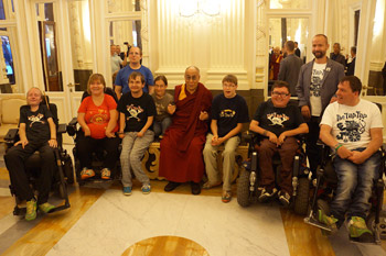 His Holiness the Dalai Lama with a group of physically challenged young people who play music together on his arrival at the Tipsport Arena before the start of his talk in Prague, Czech Republic on September 14, 2013. Photo/Jeremy Russell/OHHDL 2013-09-14-Prague-N01
