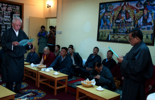 New Justice Commissioner Ngawang Choedak taking oath from Chief Justice Commissioner Ngawang Phelgyal Gyechen of the Tibetan Supreme Justice Commission.
