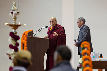 His Holiness the Dalai Lama is presented with a photo of himself with Mr & Mrs BK Birla on the veranda of Birla House taken in 1959/60 before his talk in Noida, India on December 1, 2013. Photo/Tenzin Choejor/OHHDL