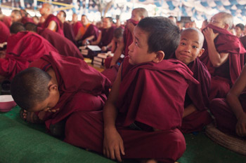 Some of the younger members of the audience attending His Holiness the Dalai Lama's teachings at Sera Jey Monastery in Bylakuppe, Karnataka, India on December 26, 2013. Photo/Kate Surjok
