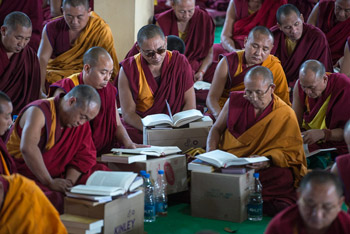 Members of the audience following the Lam Rim texts during His Holiness the Dalai Lama's fifth day of teachings at Sera Jey Monastery in Bylakuppe, Karnatak, India on December 30, 2013. Photo/Tenzin Choejor/OHHDL