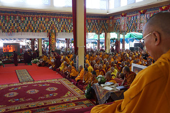 His Holiness the Dalai Lama along with the audience watching a film about the life of the Buddha at the end of the fifth day of teachings at Sera Jey Monastery in Bylakuppe, Karnatak, India on December 30, 2013. Photo/Jeremy Russell/OHHDL