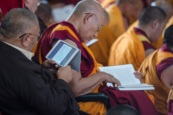 Members of the audience following the texts during His Holiness the Dalai Lama's ninth day of his teachings at Sera Jey Monastery in Bylakuppe, Karnataka, January 2, 2014. Photo/Tenzin Choejor/OHHDL