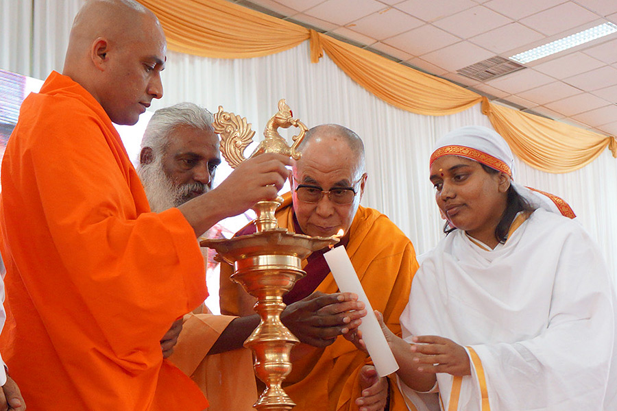 His Holiness the Dalai Lama participating in lighting the lamp to start the program in Coimbatore, Tamil Nadu, India on January 7, 2014. Photo/Jeremy Russell/OHHDL