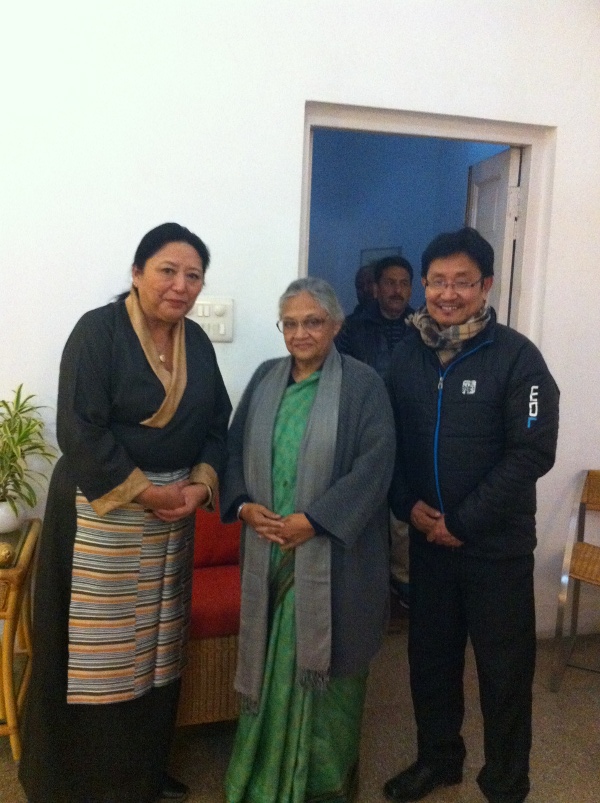 Home Kalon Dolma Gyari (left) with Shmti. Sheila Dixit (centre) and the settlement officer of Samyeling (Majnukatilla)