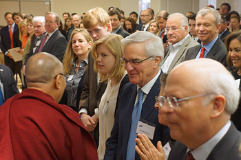 His Holiness the Dalai Lama greeting members of the audience as he arrives to participate in panel discussions at the American Enterprise Institute in Washington DC on February 20, 2014. Photo/Jeremy Russell/OHHDL
