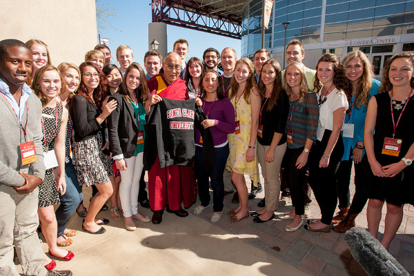 His Holiness the Dalai Lama interacts with students on his way to Santa Clara University's Leavey Center for the afternoon panel discussion on 'Compassion and Business' in Santa Clara, California on February 24, 2014. Photo/Charles Barry