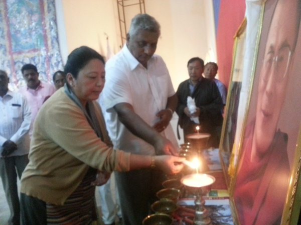 Home Kalon Dolma Gyari and MLA K. Venkatesh inaugurating the Nirantara Jyothi scheme at Bylakuppe.