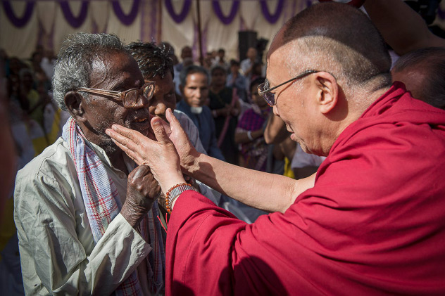 His Holiness the Dalai Lama greeting a resident on his arrival at the Tahirpur Leprosy Complex in New Delhi, India on March 20, 2014. Photo/Tenzin Choejor/OHHDL