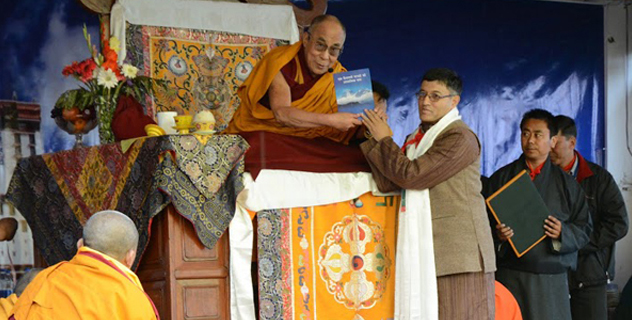 His Holiness the Dalai Lama releasing a book at the Central School for Tibetans in Shimla, India, on 18 March 2014/DIIR photo/Tenzin Phende