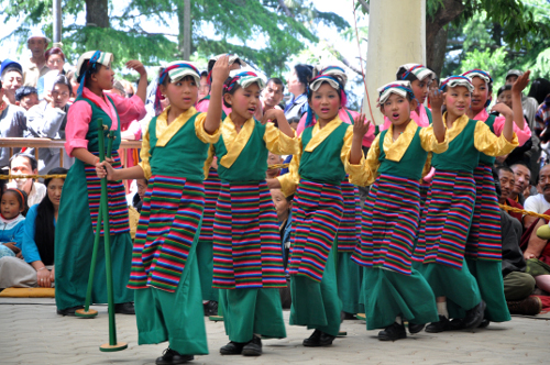 Tibetan children performing a cultural song at the 25th birth anniversary of the 11th Panchen Rinpoche. DIIR Photo/ Tenzin Phende