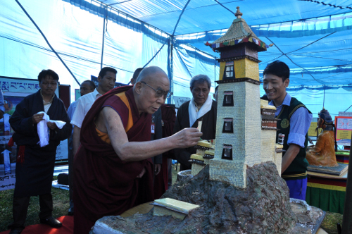 His Holiness the Dalai Lama looking at an exhibition by Tietan students at the school. DIIR Photo/Tenzin Phende