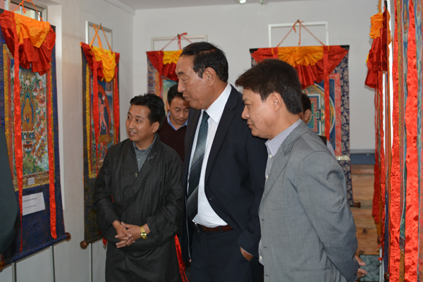 Kalon Pema Chhinjor (c) and DIIR Secretary Tashi Phuntsok look at collections of traditional paintings during the celebration of the International Museum Day at Tibet Museum in Dharamshala, India, on 18 May 2014/DIIR Photo