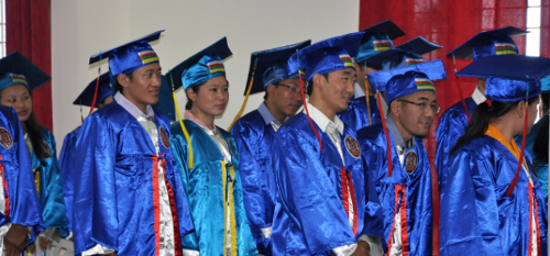 Students in ceremonial gowns eagerly waiting for their names during the ceremony. (DIIR Photo)