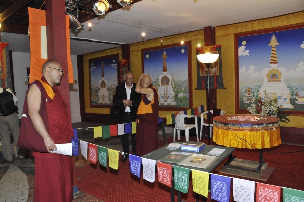 Deputy Speaker Khenpo Sonam Tenphel viewing the exhibition as Mr. Sonam Tsering Frasi, Former member of Tibetan Parliament speaks to an acquaintance at the final day of the festival.