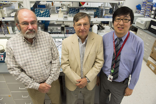 From left: Lead researchers of the new study, Donald A. McClain, endocrinologist and a professor of internal medicine, Josef Prchal, a professor of internal medicine at the U. School of Medicine, and Tsewang Tashi, a Tibetan who is a hematologist and researcher at the Huntsman Cancer Institute, in Prchal's lab at the University of Utah Medical Center, on Friday, 15 August 2014/Photo/Rick Egan/The Salt Lake Tribune