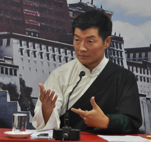 Sikyong gestures while speaking about the need to strengthen women for acollective development of the Tibetan community, at a program organised by TWA, 5 August 2014. (DIIR Photo)