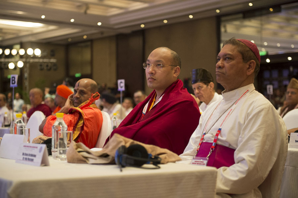 H.E. 17th Karmapa Ogyen Thinley Dorjee and H.g. Archbishop Dr. Felix Machado during the Inaugural Ceremony of 'A Meeting of Diverse Spiritual Traditions in India' convened by His Holiness the Dalai Lama in New Delhi, India on September 20, 2014. Photo/Tenzin Choejor/OHHDL