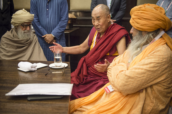 His Holiness the Dalai Lama speaking with Maulana Wahiduddin Khan and Sheikhul Masheih Dewan Syed Zainul Abedin Ali Khan during the lunch break of the first day of the two day 'Meeting of Diverse Spiritual Traditions in India' in New Delhi, India on September 20, 2014. Photo/Tenzin Choejor/OHHDL