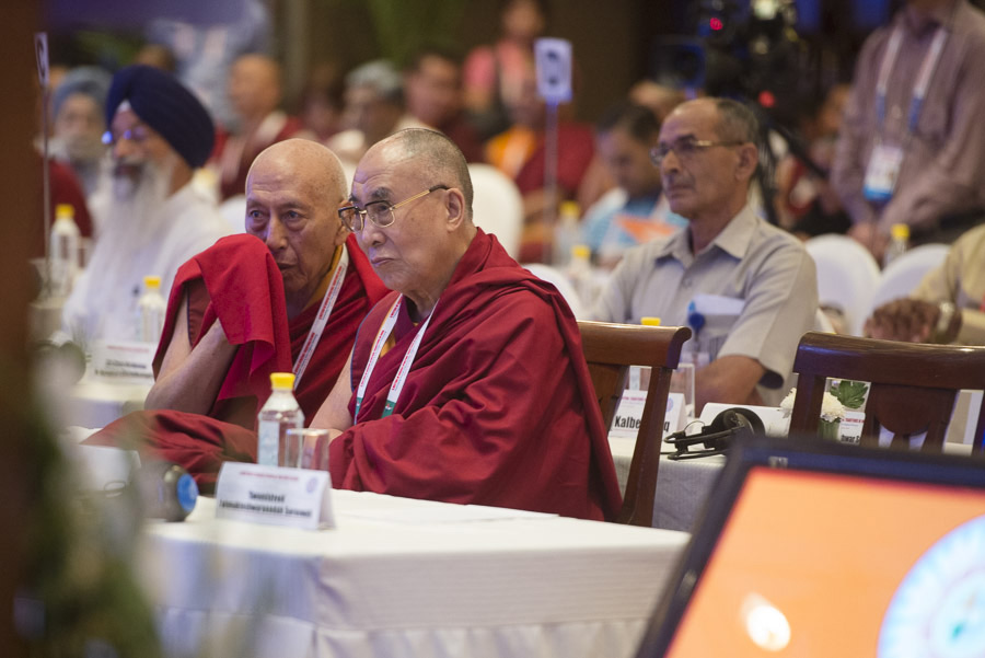 Prof Samdhong Rinpoche interpreting Hindi to Tibetan for His Holiness the Dalai Lama during the second plenary session of the Meeting of Diverse Spiritual Traditions in New Delhi, India on September 21, 2014. Photo/Tenzin Choejor/OHHDL