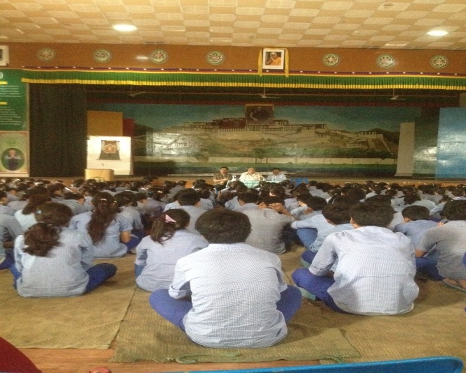 Health Secretary speaking about Middle Way Approach at TCV Selaqui.