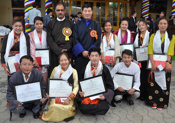 Mr Ravi Thakur and Sikyong with PhD recipients and Gaden Phodrang awardees on the occasion of the 54th Tibetan Democracy Day in Dharamshala, India, on 2 September 2014/DIIR Photo
