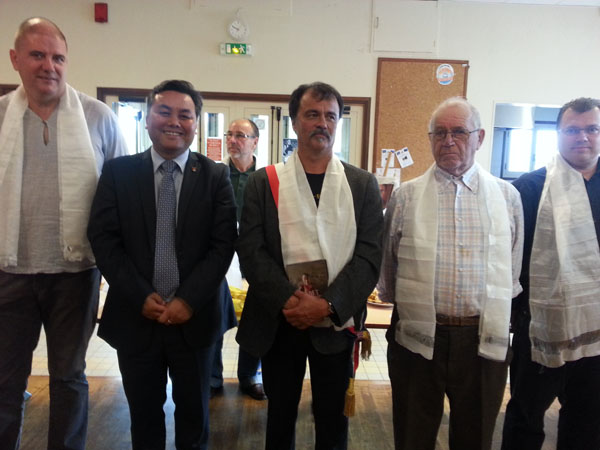 Secretary Tsering Dhondup of Office of Tibet in Paris with French municipal authorities during the adoption of Tibet's Drikung region