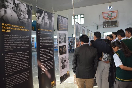 Students throng the exhibition venue to view the panels on Tibetan self-immolations.