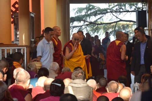 His Holiness the Dalai Lama greeting devotees on his way to the teaching venue, 6 October 2014.
