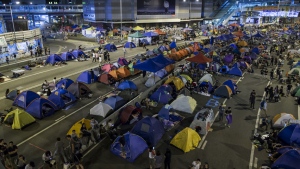 Occupy Central movement protesters sleep in tents as pro-democracy protesters block areas around the government headquarters building in Hong Kong early Oct. 12, 2014. (Tyrone Siu/Reuters)
