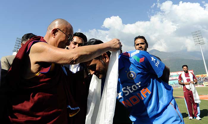 His Holiness the Dalai Lama blesses Indian captain Mahendra Singh Dhoni in Dharamshala, the venue of the fourth ODI vs West Indies.