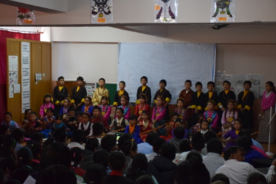 school children the school performing a cultural song to celebrate the birthday of Prof. Samdhong Rinpoche, former Kalon Tripa of the Central Tibetan Administration.