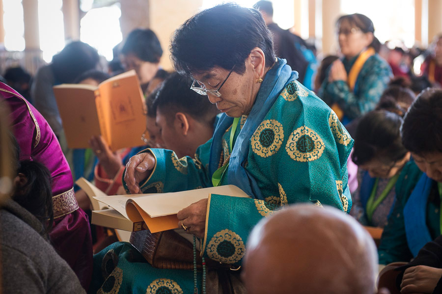Members of the audience from Mongolia following the text of His Holiness the Dalai Lama teachings at the Main Tibetan Temple in Dharamsala, HP, India on December 2, 2014. Photo/Tenzin Choejor/OHHDL