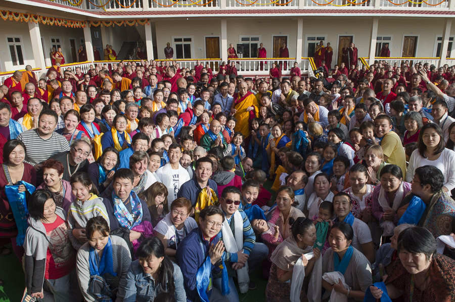 His Holiness the Dalai Lama poses for a group photo in front of the new hostel for students from Mongolian regions at Drepung Gomang Monastery in Mundgod, Karnataka, India on December 25, 2014. Photo/Tenzin Choejor/OHHDL