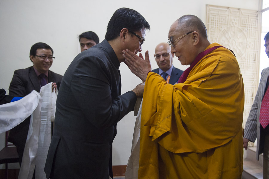 His Holiness the Dalai Lama greeting Indian Union Minister of State for Home Affairs Kiren Rijiju before ceremonies commemorating his first teaching in 55 years ago at a ceremony at Ganden Jangtse Monastery in Mundgod, Karnataka, India on December 26, 2014. Photo/Tenzin Choejor/OHHDL