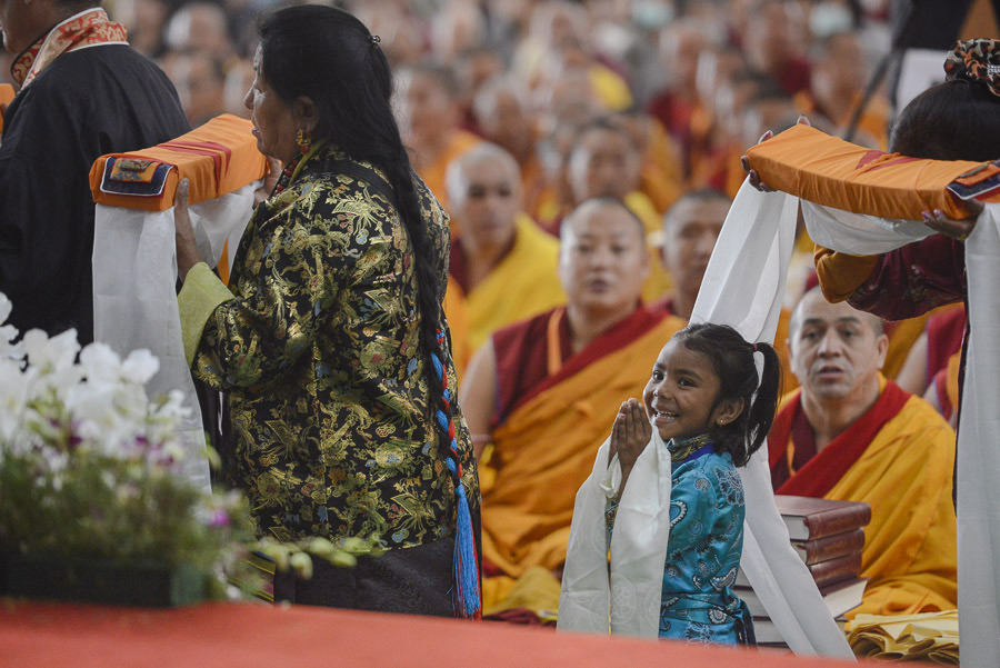 People from Dagyab Kham region walking by with offerings during the Long Life Offering Ceremony for His Holiness the Dalai Lama at Ganden Jangtse Monastery in Mundgod, Karnataka, India on December 26, 2014. Photo/Tenzin Choejor/OHHDL