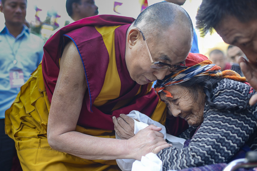 His Holiness the dalai Lama comforting an elderly Tibetan on his arrival at Ganden Jangtse Monastery in Mundgod, Karnataka, India on December 28, 2014. Photo/Tenzin Choejor/OHHDL